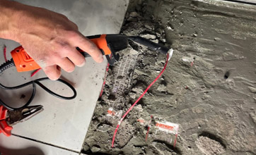 electrician repairing underfloor heating