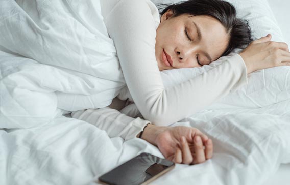 woman asleep in a warm bed